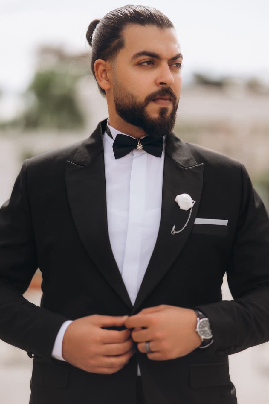 Man in a black tuxedo and bow tie