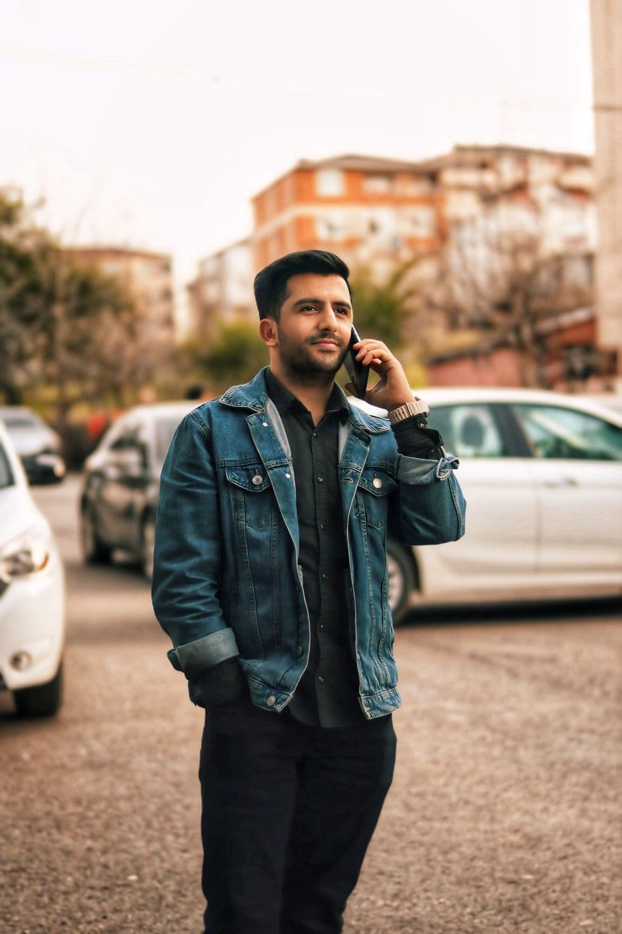 Man in a denim jacket and dark jeans